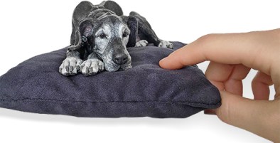 mini sclupture of a resting dog